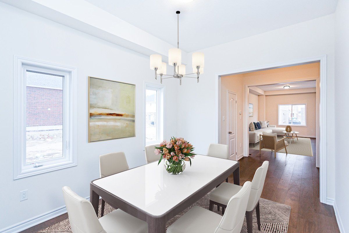A dining room with a table and chairs and a chandelier.