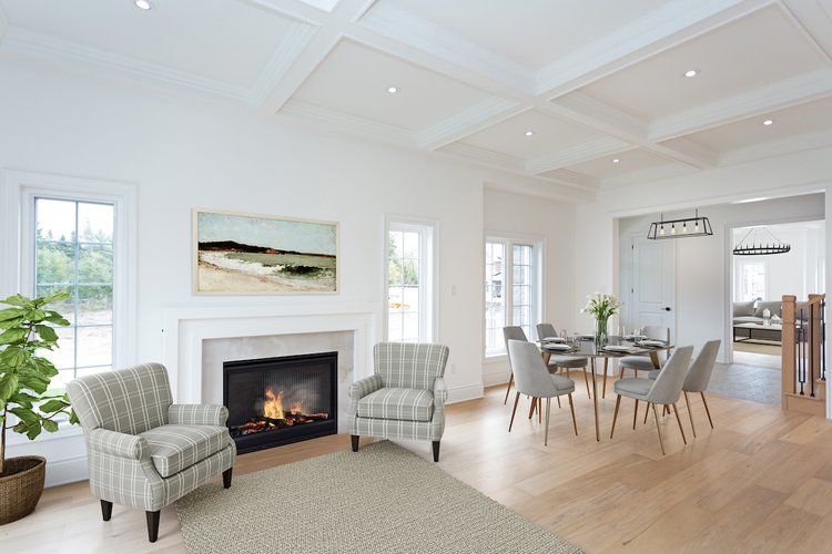 A living room with two chairs and a fireplace