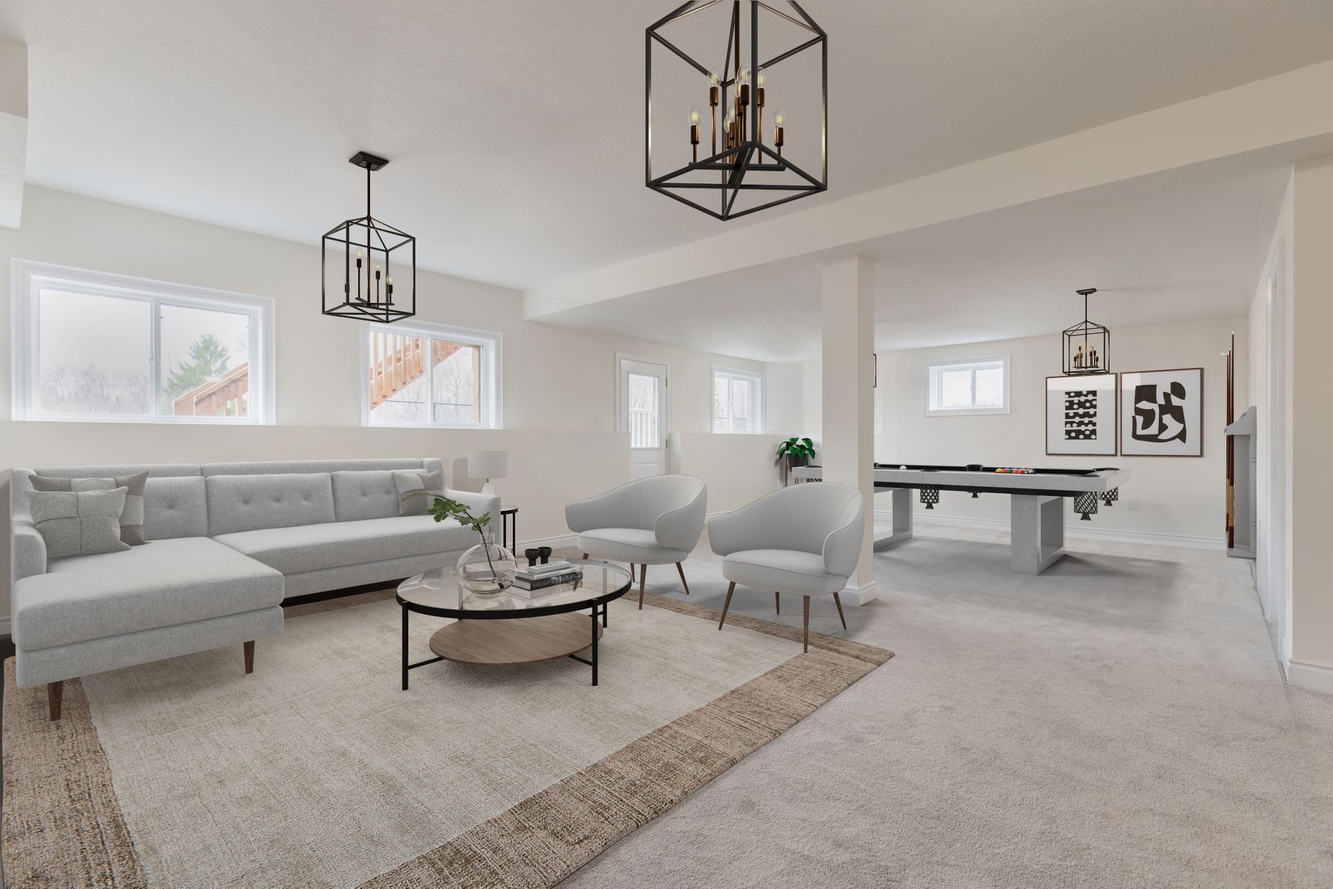 Spacious, bright basement with a gray sectional, armchairs, coffee table, and pool table, illuminated by modern chandeliers.