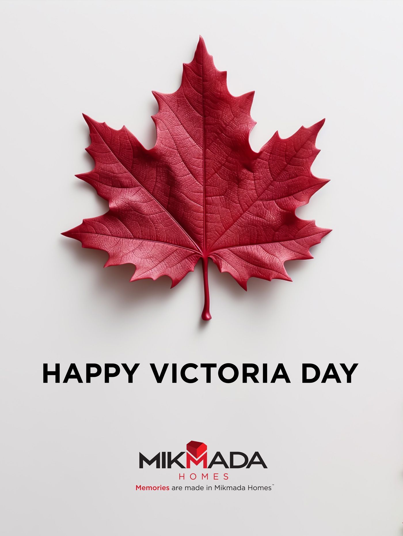 A red maple leaf on a white background that says happy victoria day