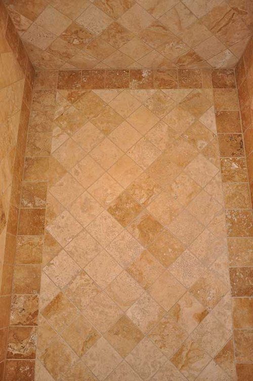 A close up of a tiled floor in a bathroom.