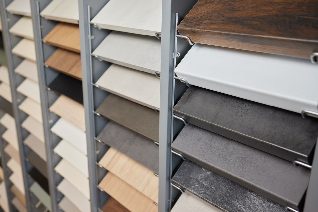 Color swatches fanned out, showcasing shades of gray, green, and beige.