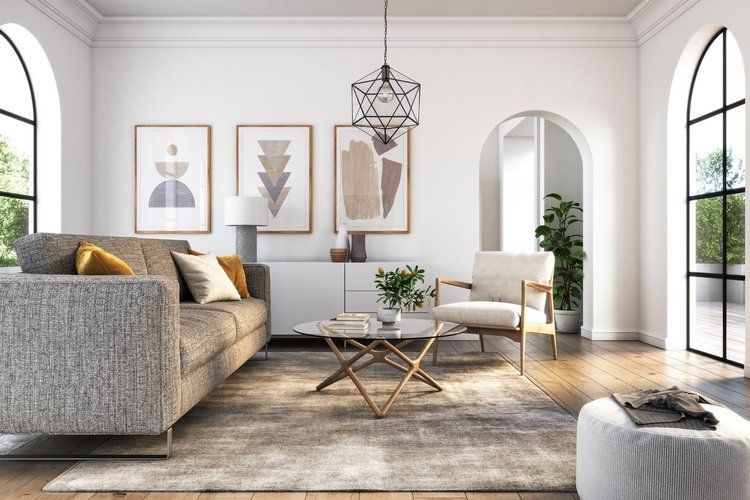 A living room with a couch , chair and coffee table.