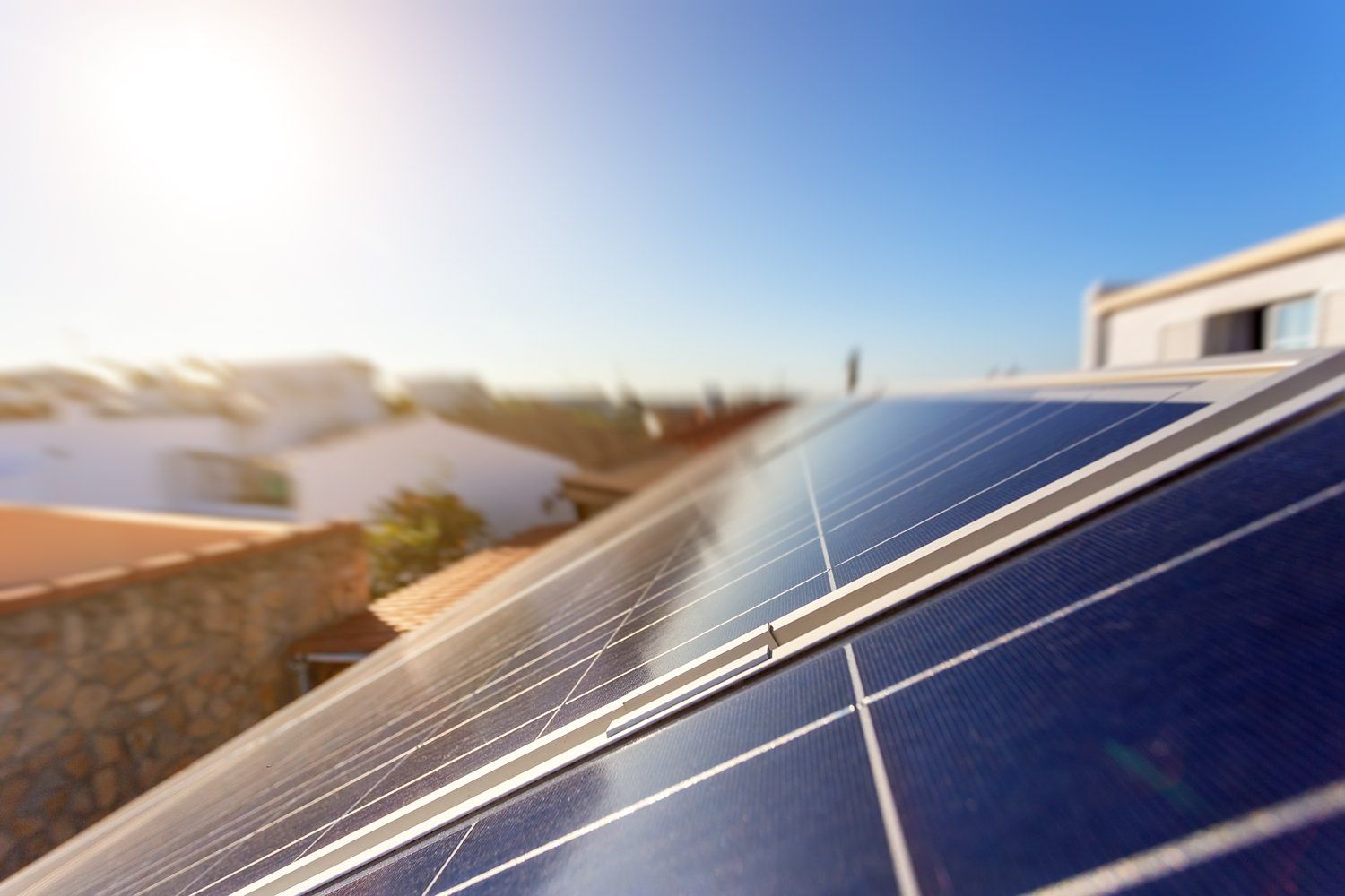 A close up of a solar panel on the roof of a building.