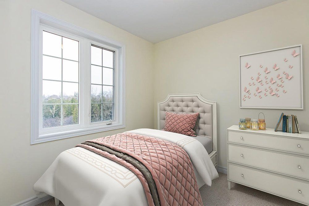 A bedroom with a single bed , dresser , and window.