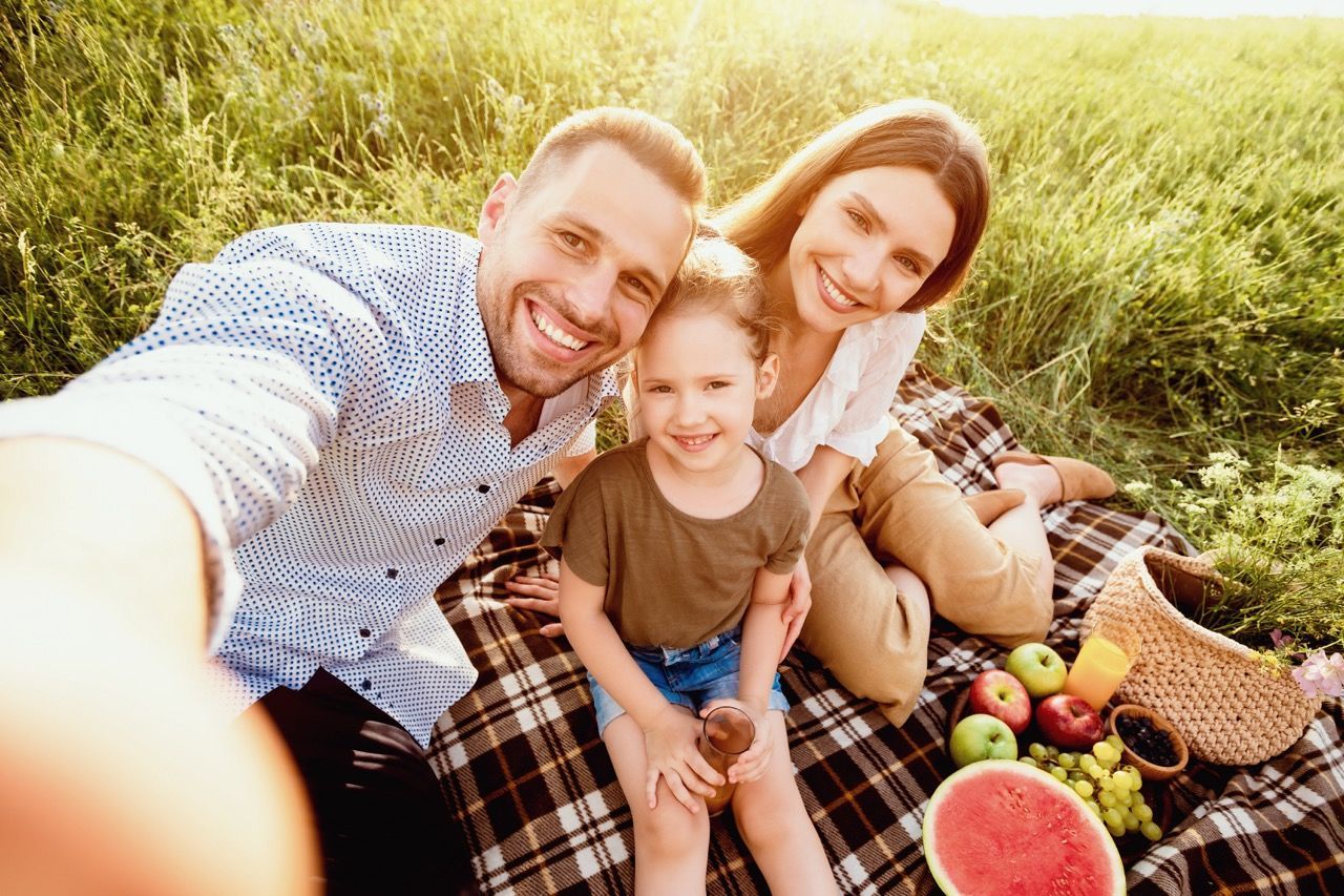 Happy family enjoying a summer picnic.