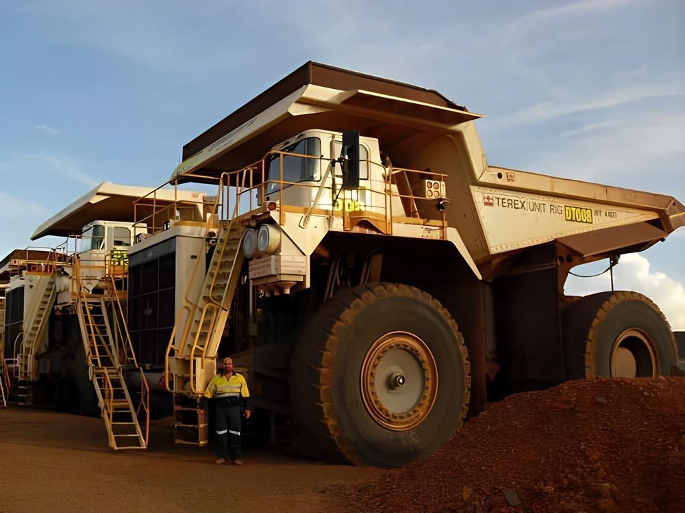 A Man Worker And Bucyrus — Local Electricians in Lavington, NSW