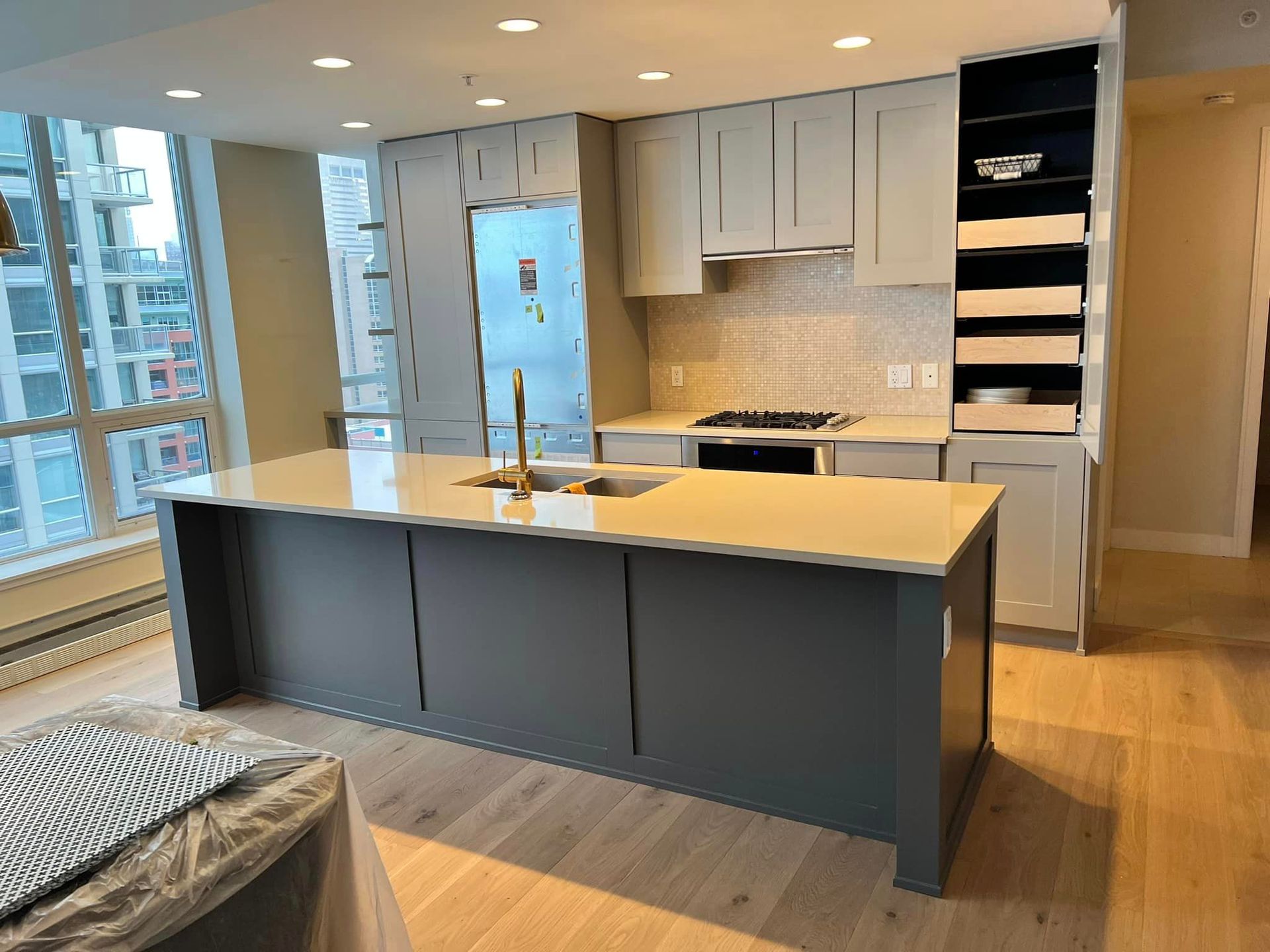 A kitchen with a large island in the middle of the room.