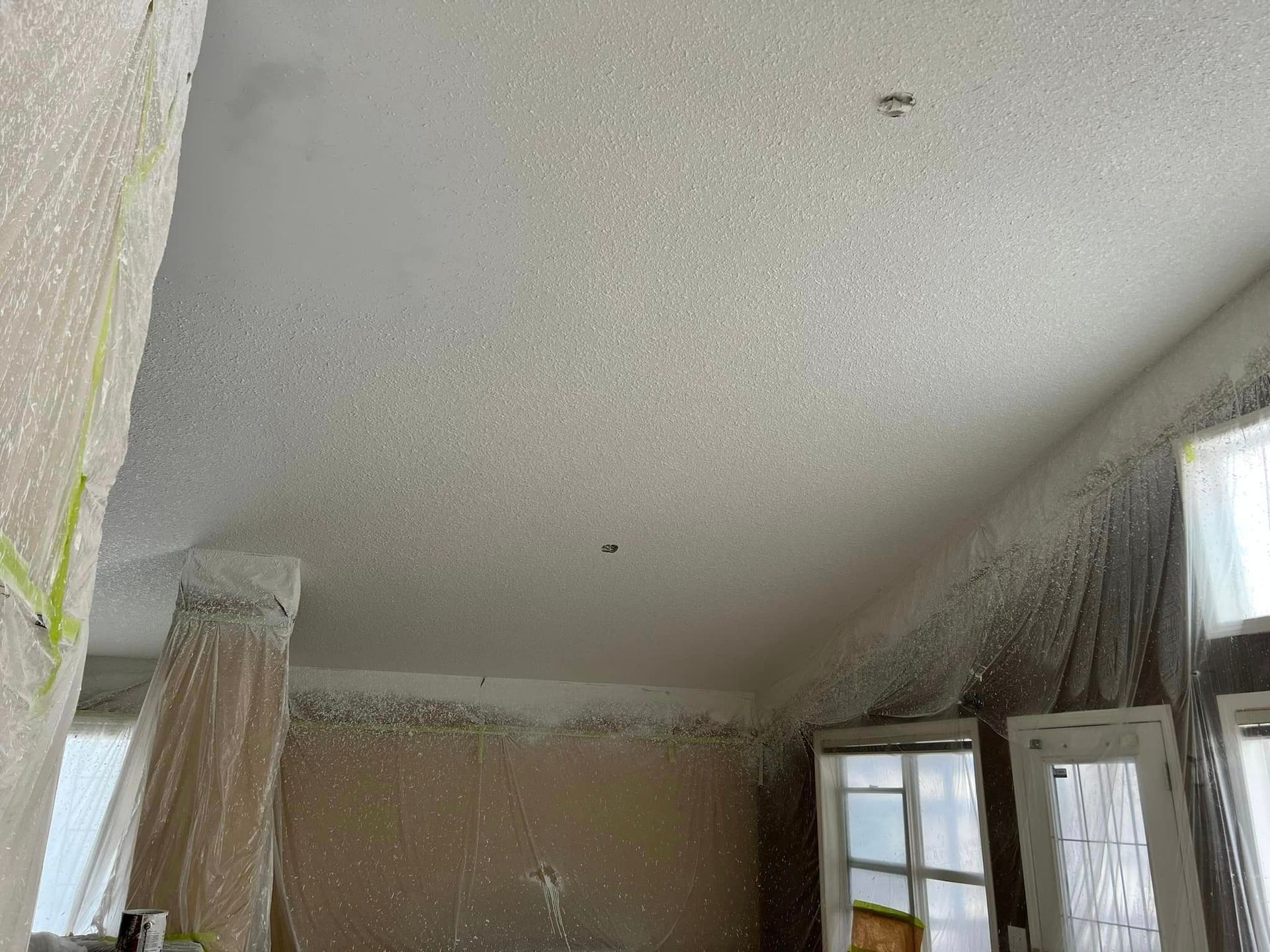 A room with a ceiling that is covered in white paint.