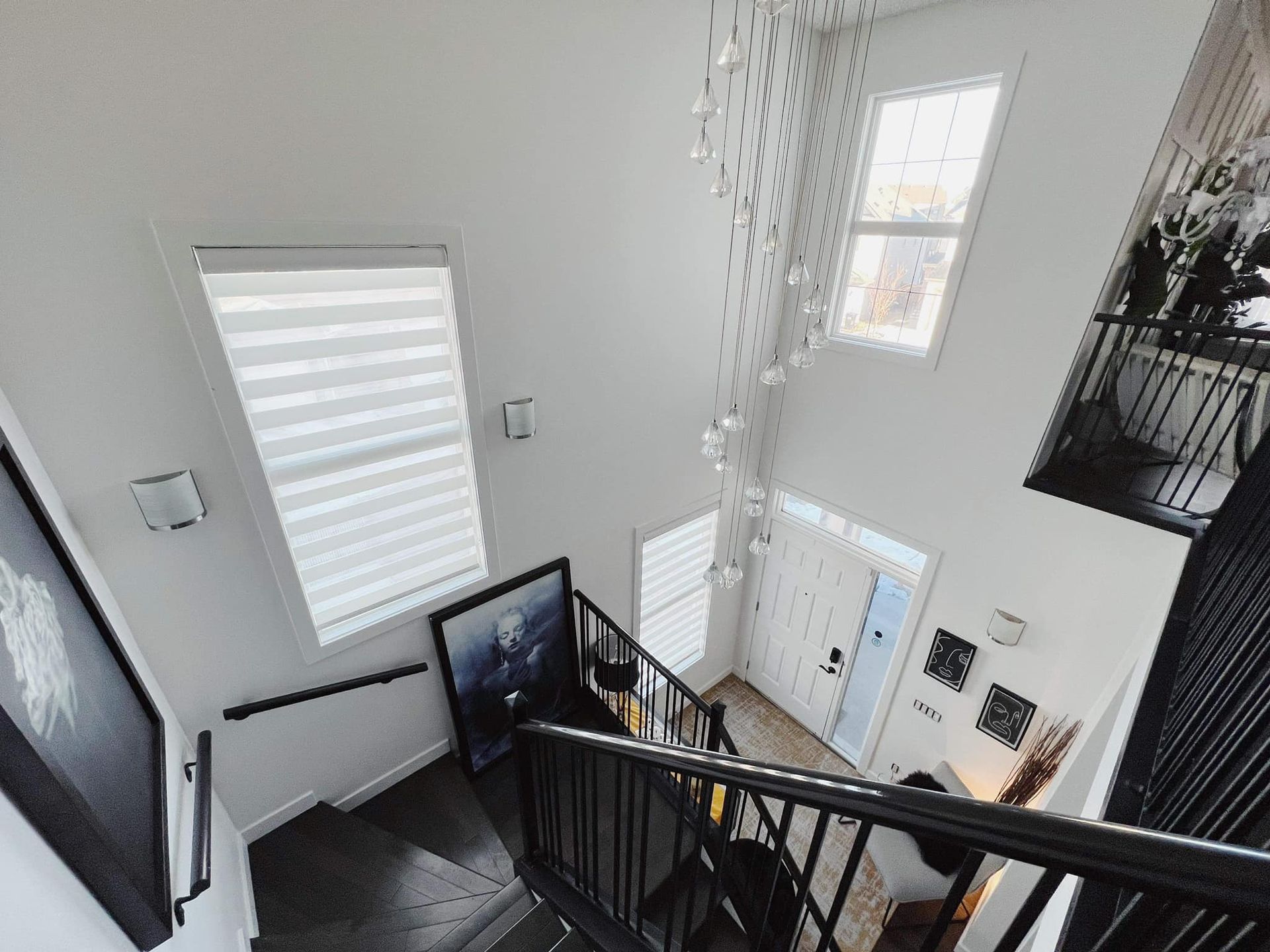 An aerial view of a staircase leading up to the second floor of a house.
