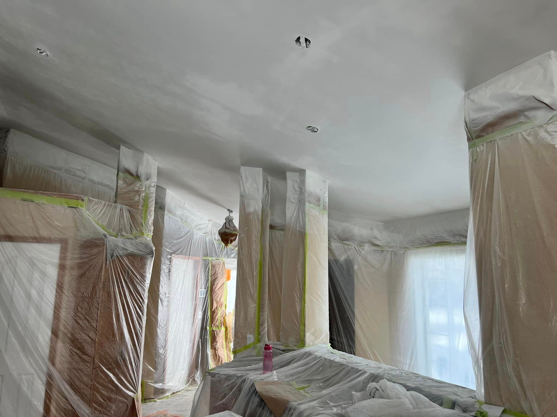 A room with a ceiling that is covered in plastic.