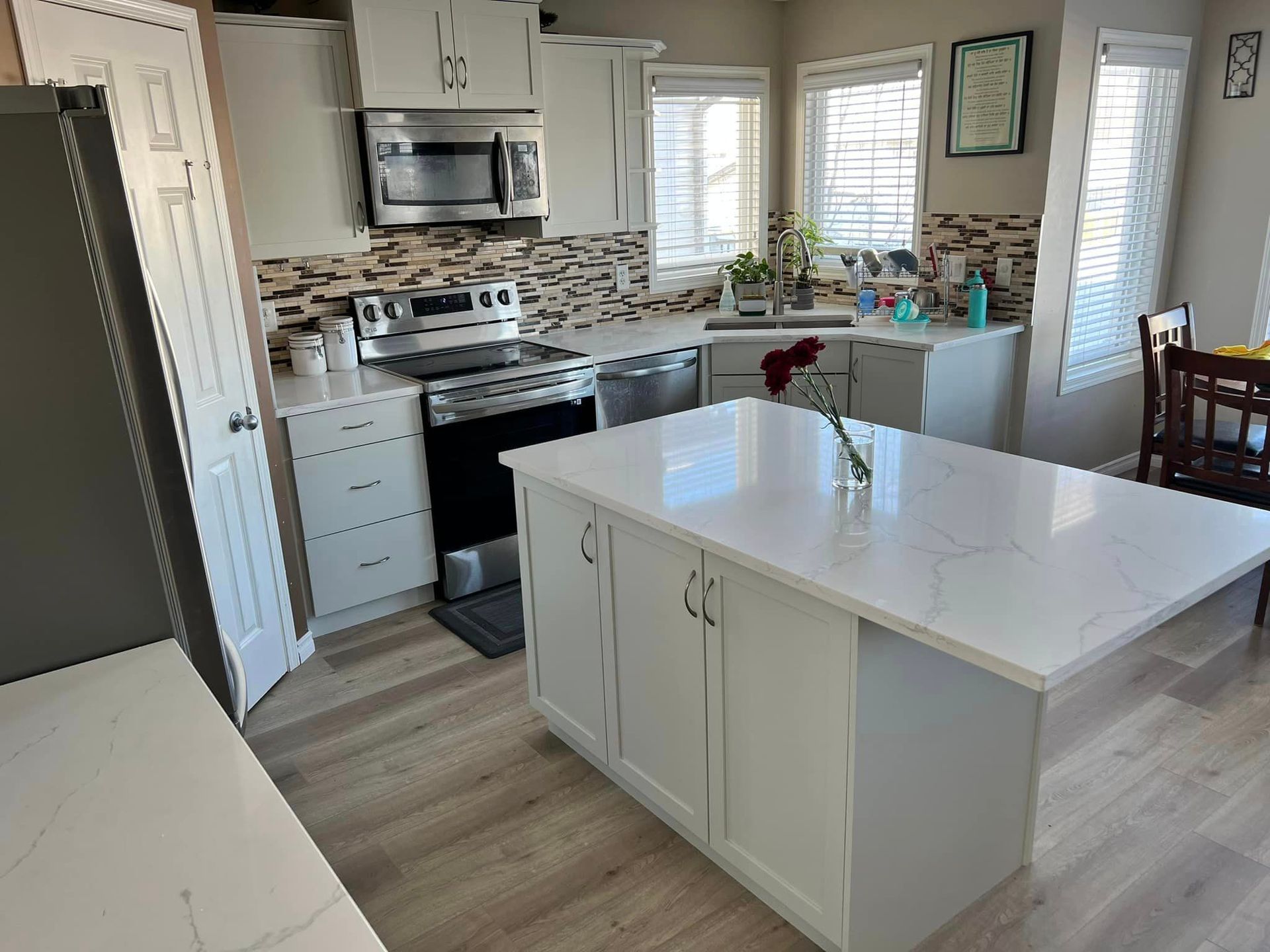 A kitchen with a large island in the middle of it.