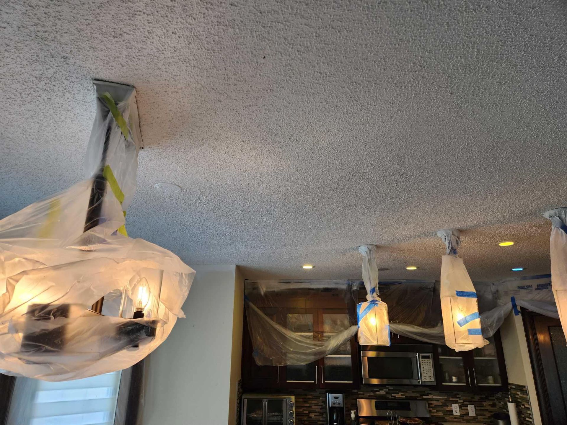 A ceiling with a few lights hanging from it