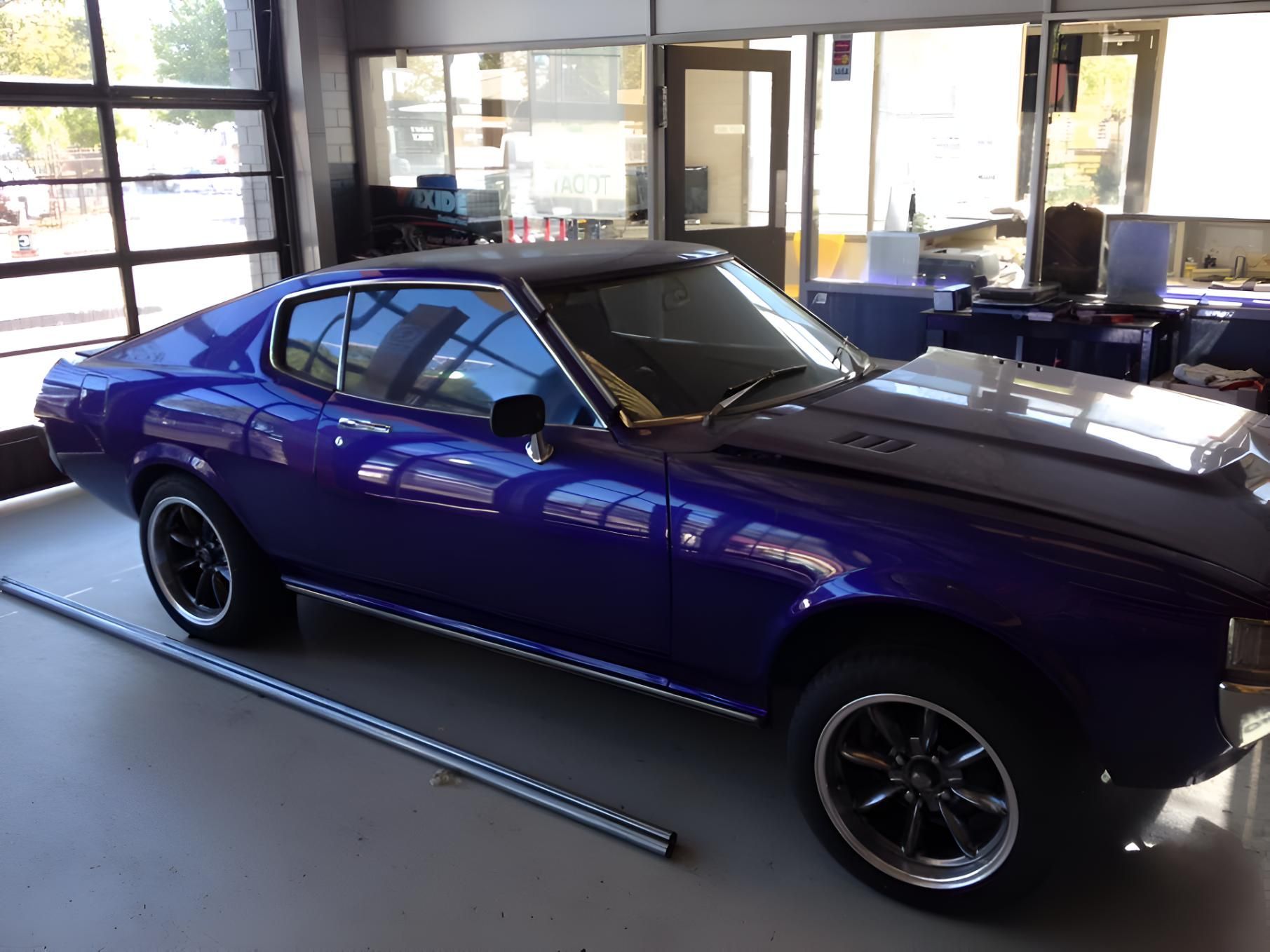 A Purple Car Is Parked In A Garage — P & V Panel Works In Alice Springs, NT