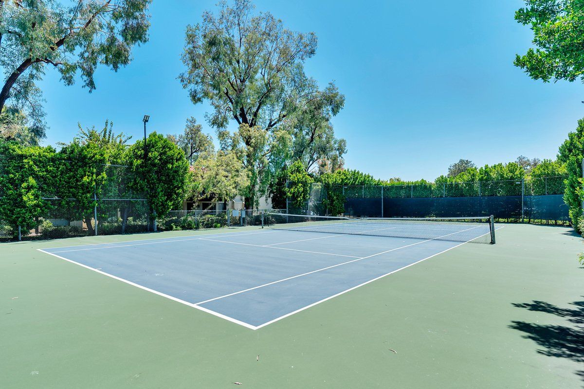 Mission Plaza Apartments Property Image of tennis court