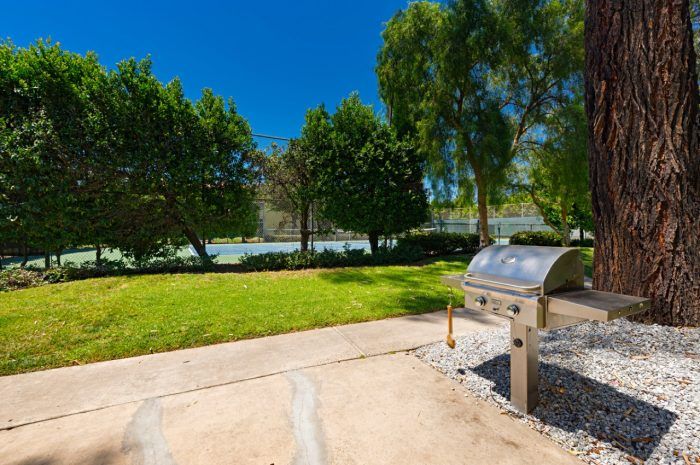 Mission Plaza Apartments Property Image of exterior BBQ