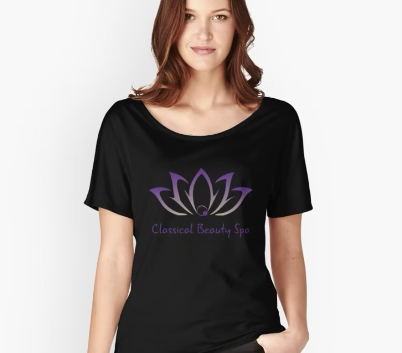 A woman wearing a black t-shirt that says classical beauty spa