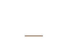 A wooden stick is sitting on a white surface.