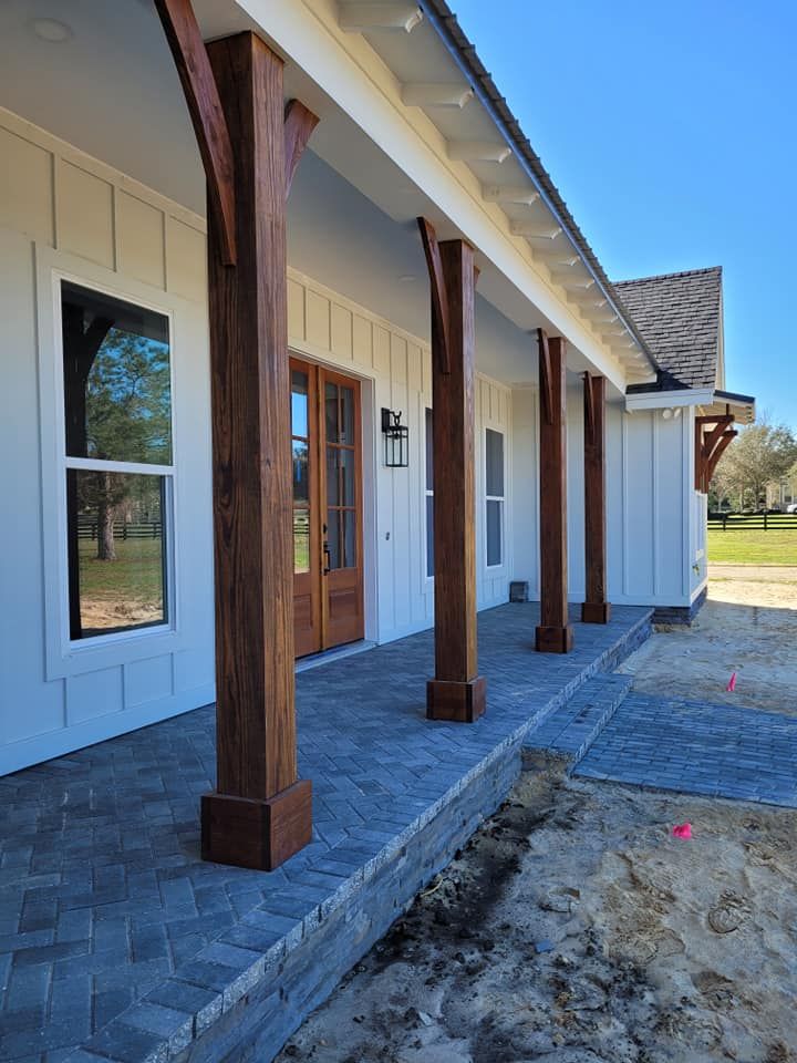White house porch with brick pavers