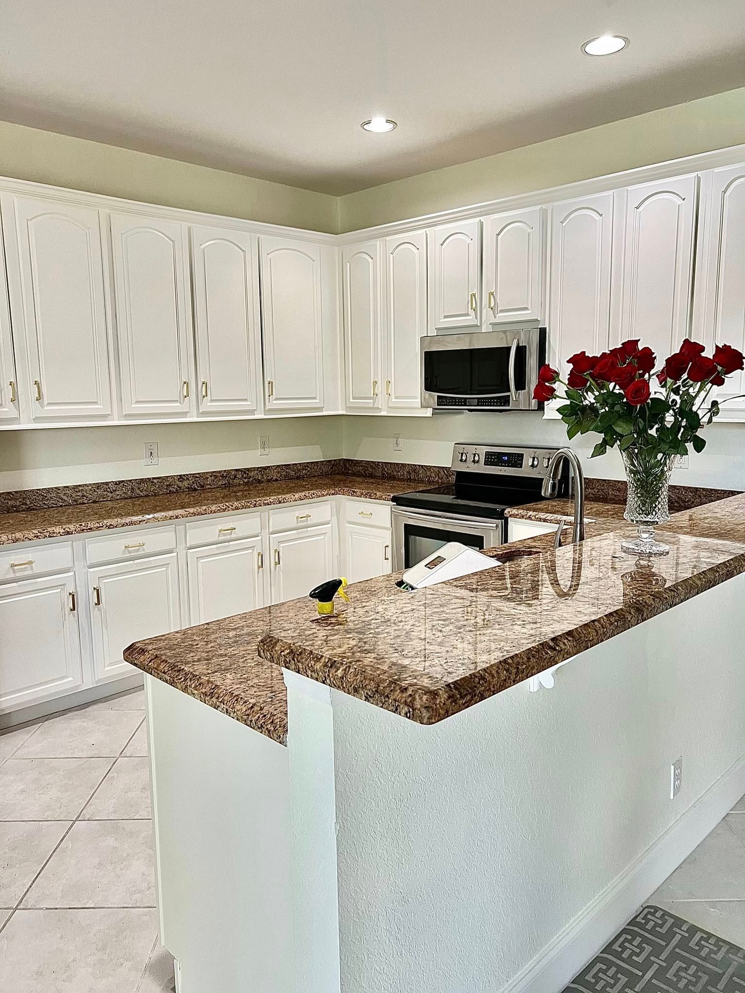 White kitchen with granite countertops
