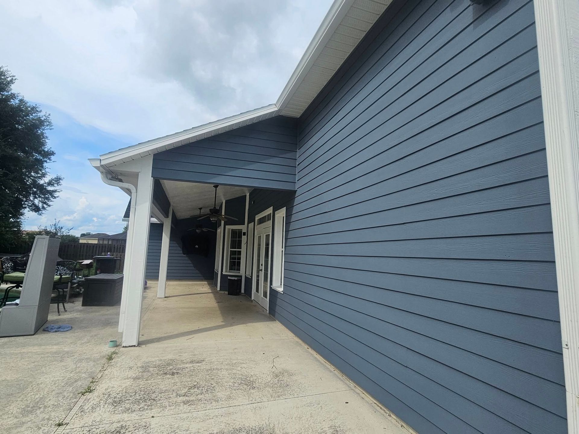A building with blue siding and white trim