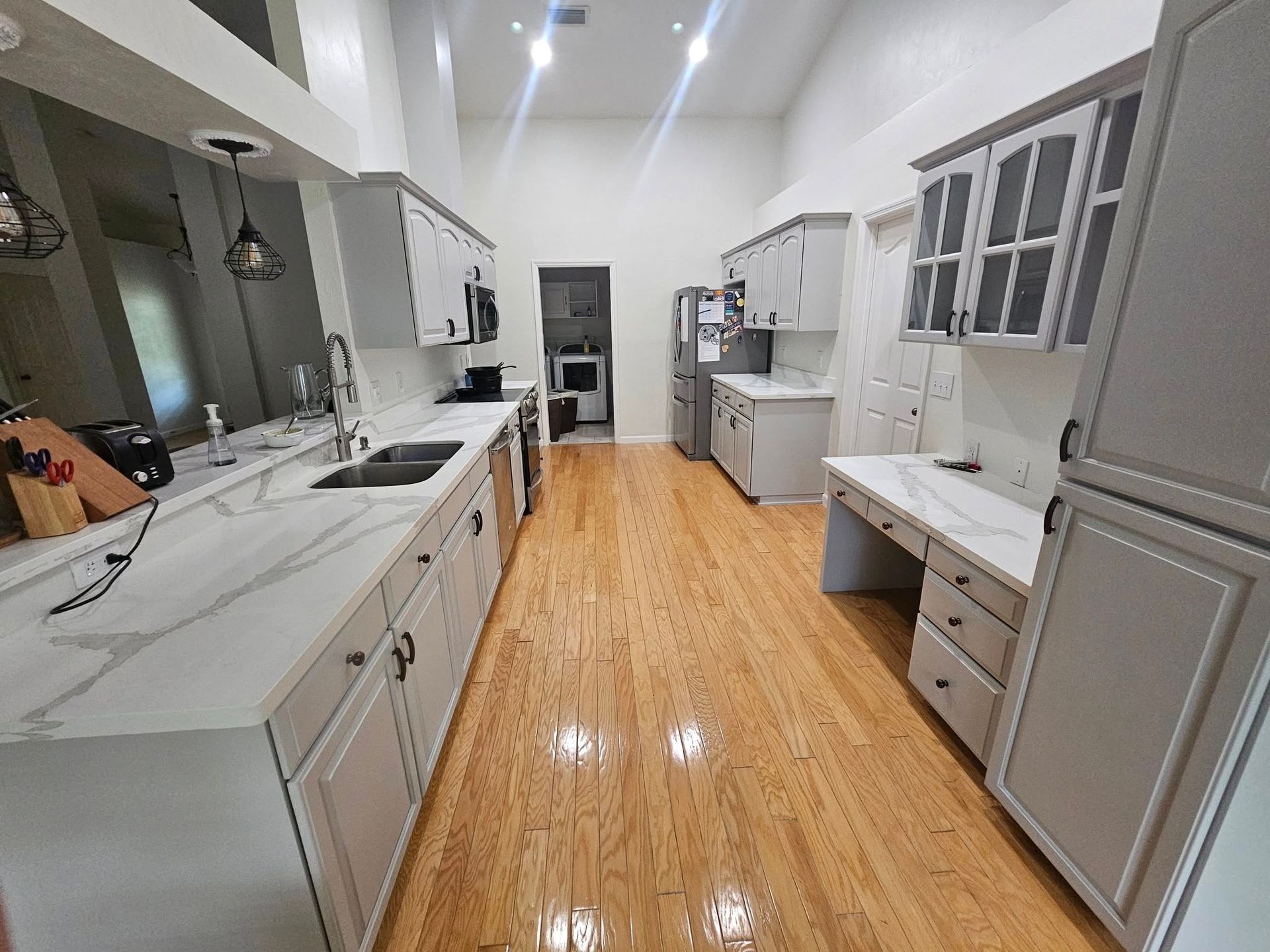 Spacious kitchen with light wood floors