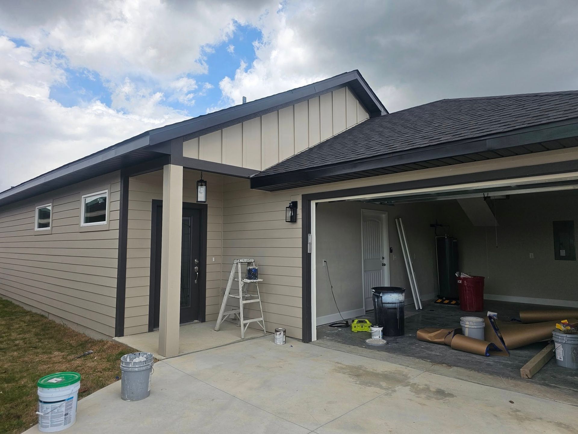 Tan house with black trim