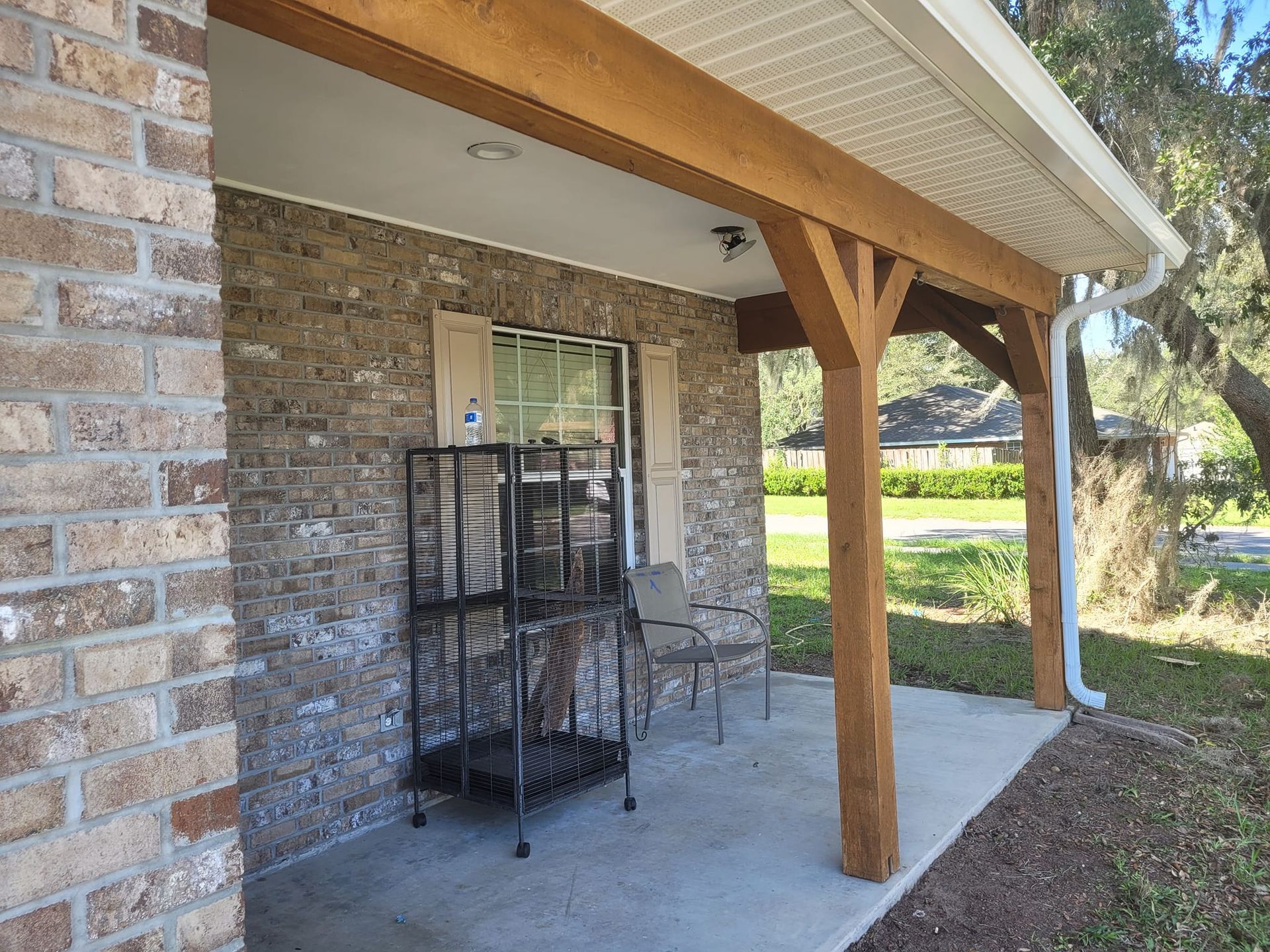 A brick building with a covered porch
