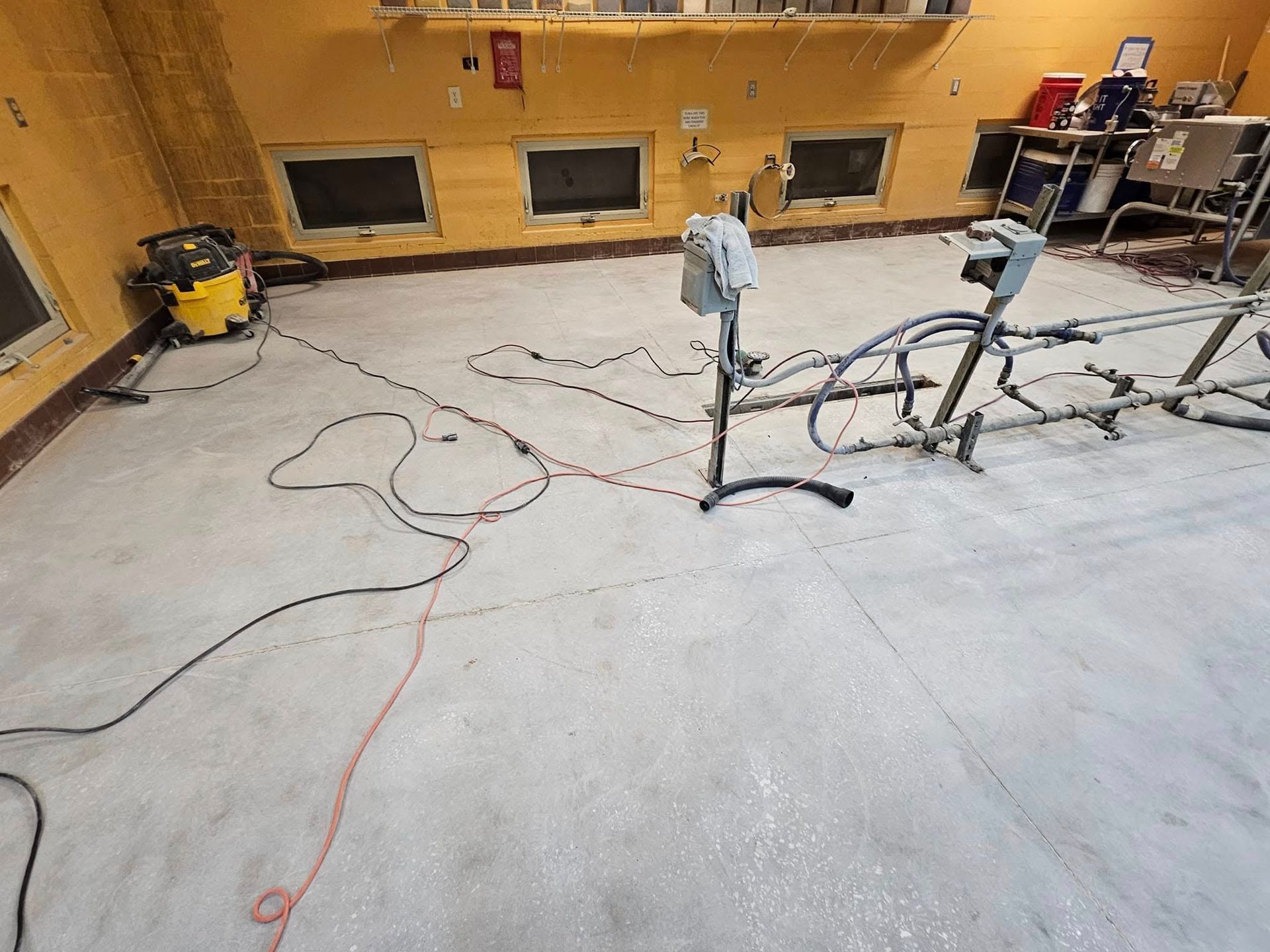 Gray concrete floor with electrical cords
