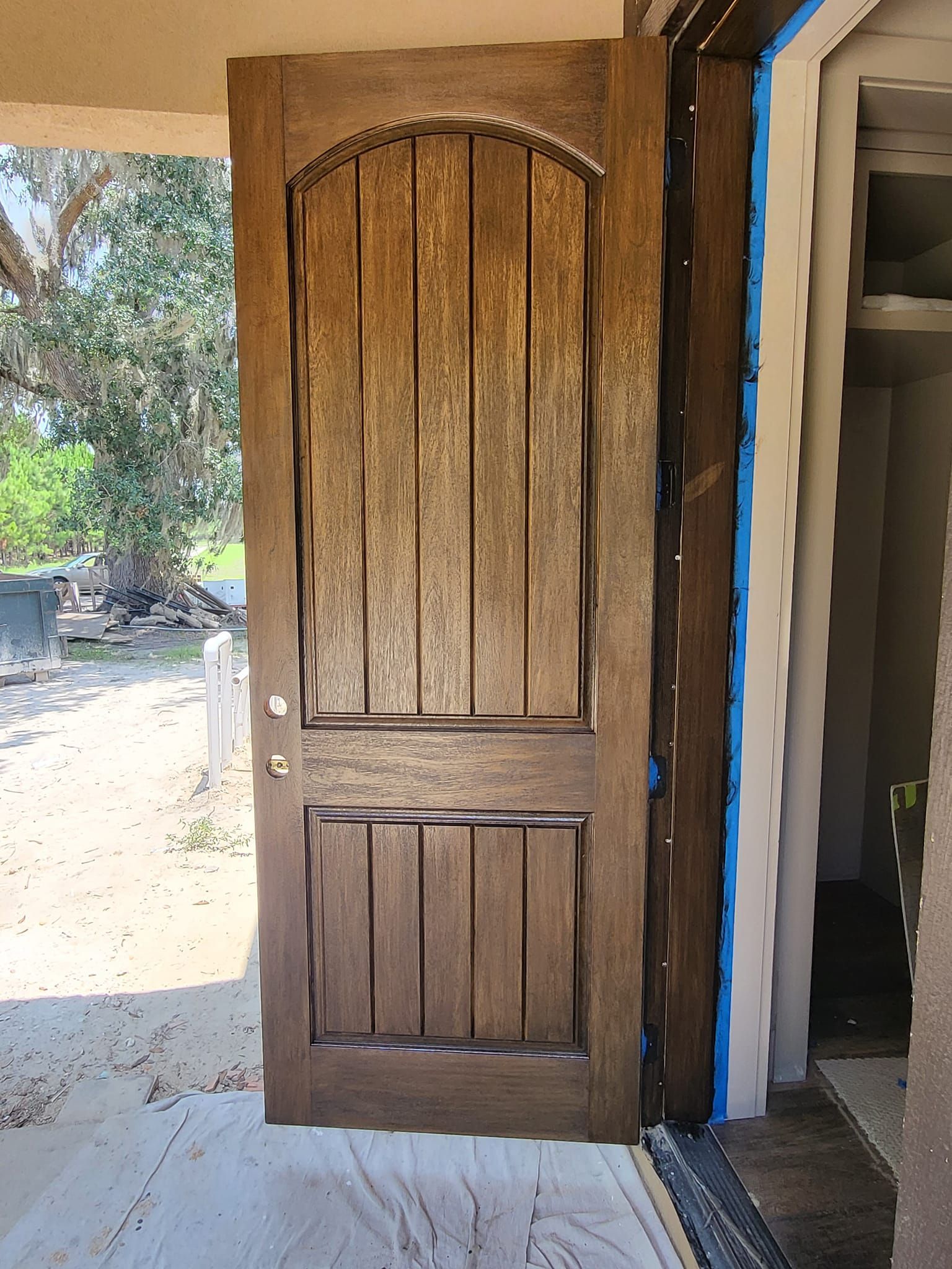 Brown wooden door with vertical panels