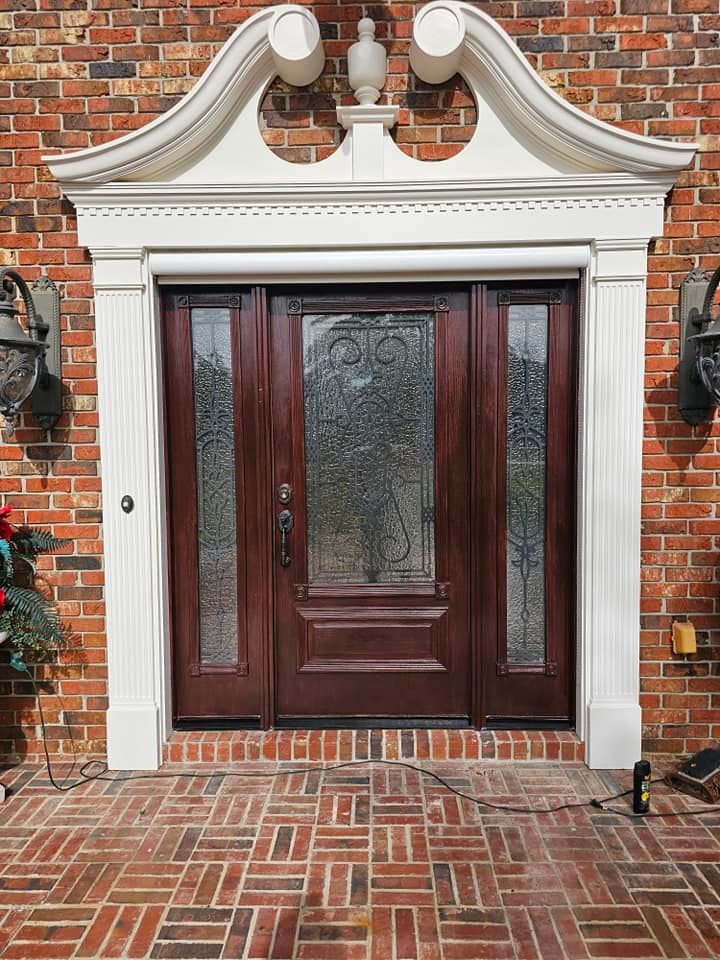 Brick facade with dark wood front door