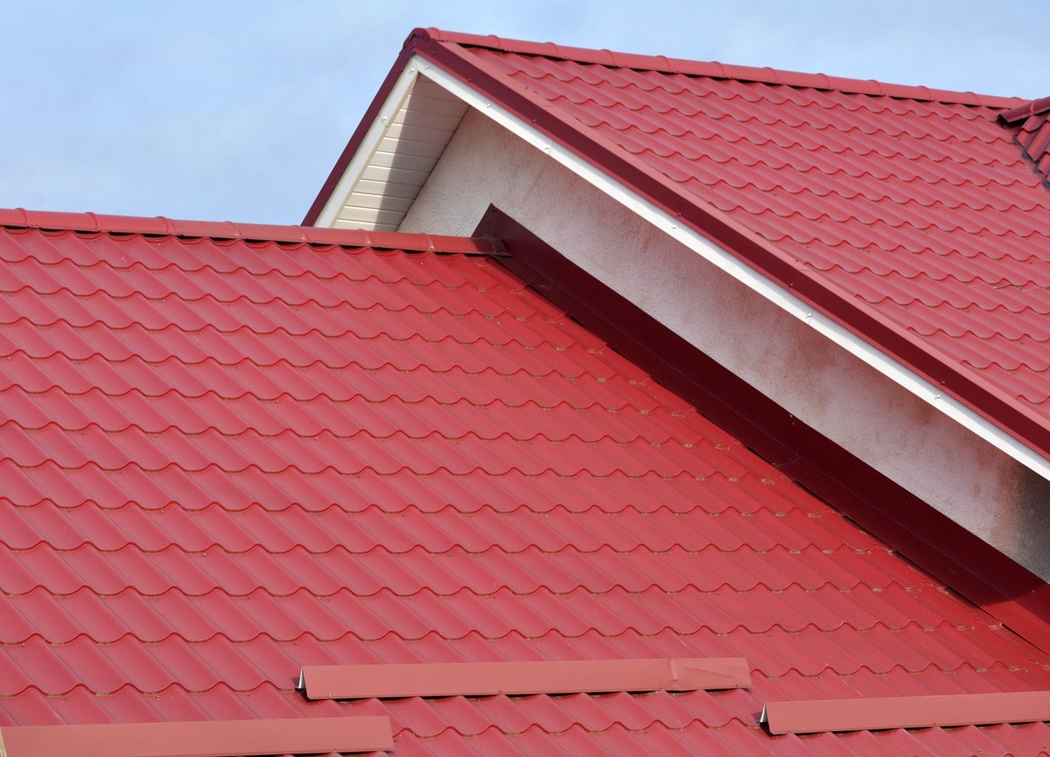Red metal roof on a house