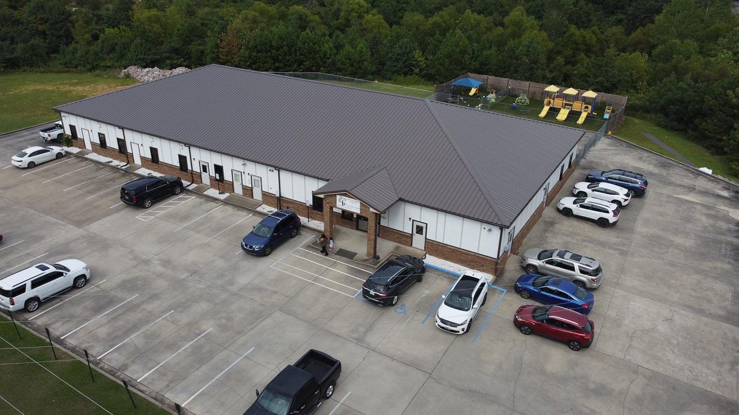 Aerial view of a building with metal roof