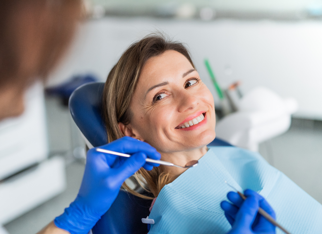 Woman smiling at dentist | Get dental crowns and bridges in Oelwein IA