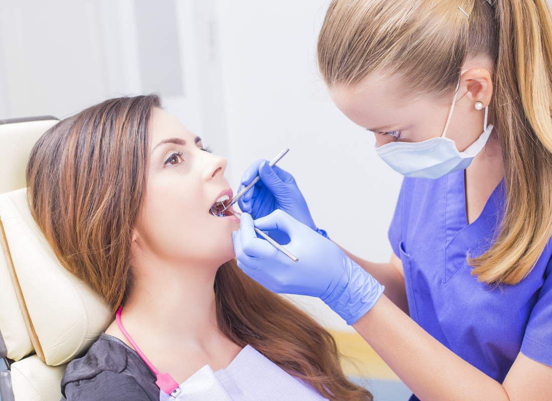 dentist working and dental patient | preventative general dentist in Oelwein IA | Teeth cleanings