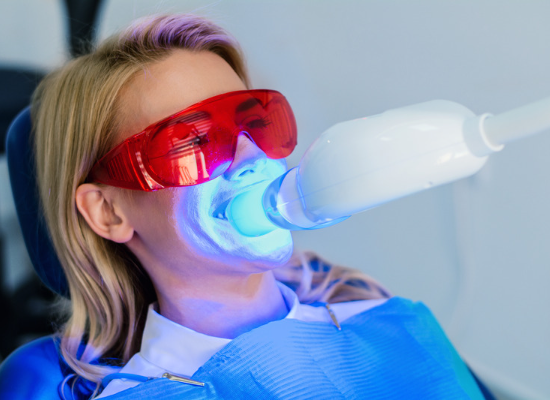 Woman getting teeth whitened | Dentist in Oelwein IA
