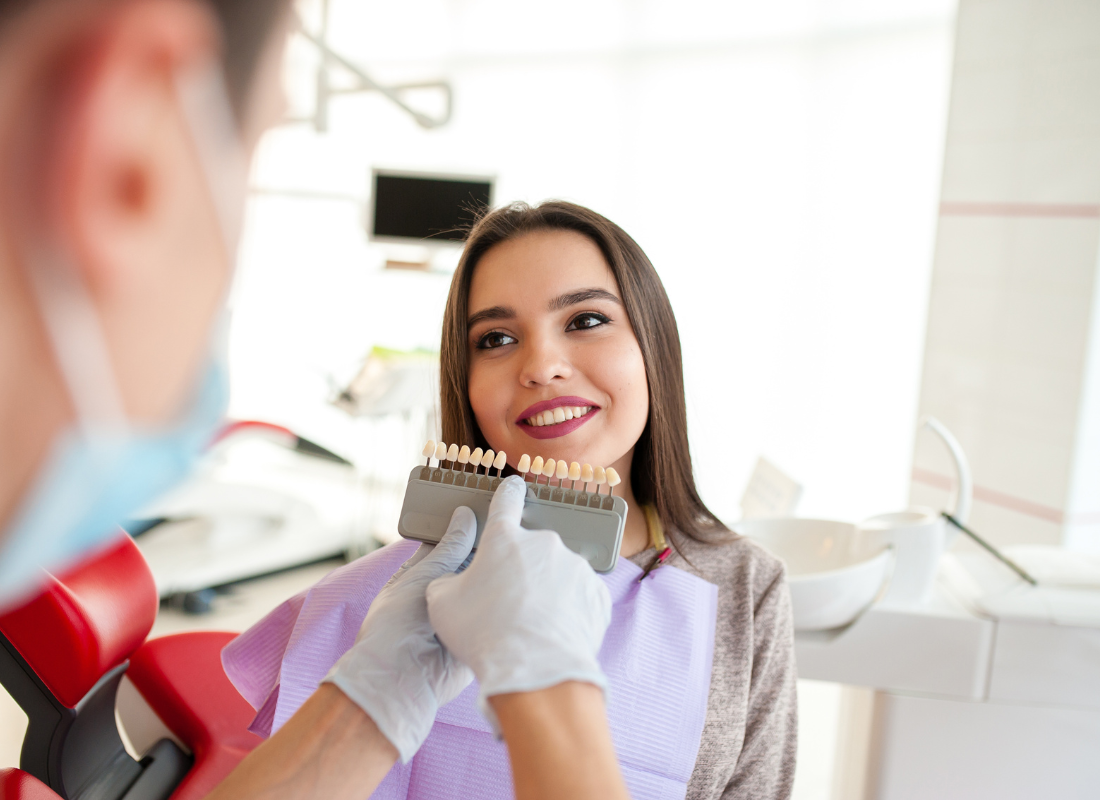 woman at dentist with veneers | Dental Veneers in Oelwein IA