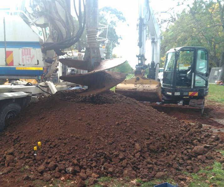 Truck Digging in Soil — Earthmoving in Southern Highlands, NSW