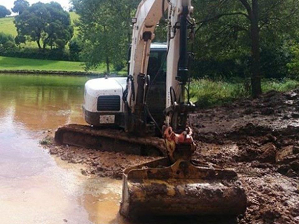 Excavator Digging Dirt Out Of Lake — Excavation in Southern Highlands, NSW