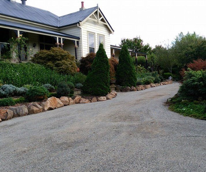 Home With Garden Along Driveway — Landscaping in Southern Highlands, NSW