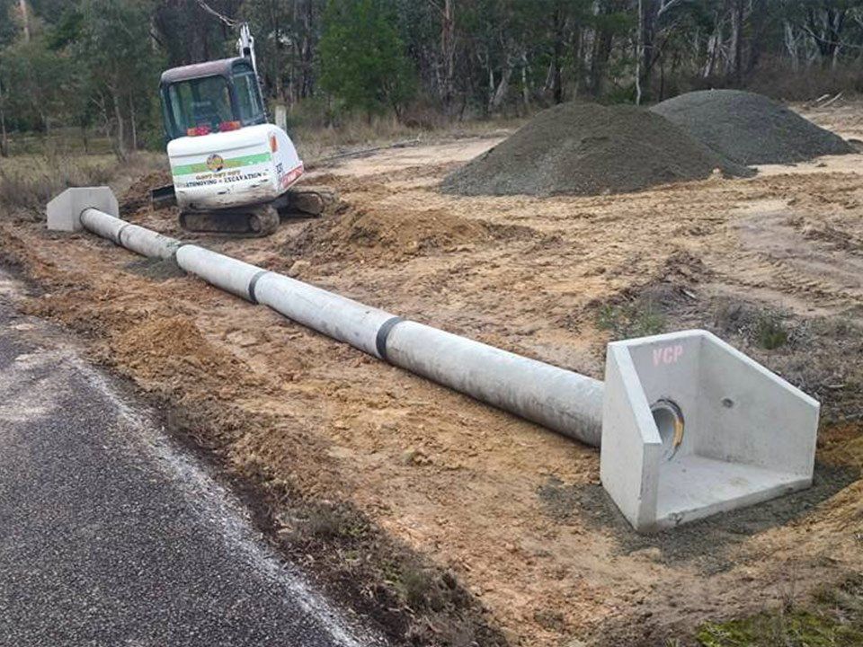 Installing Pipe Underground — Excavation in Southern Highlands, NSW