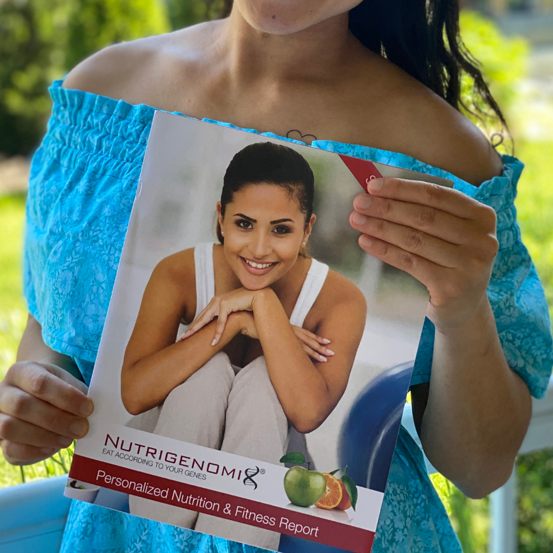 Woman in blue dress holding a magazine cover labeled 