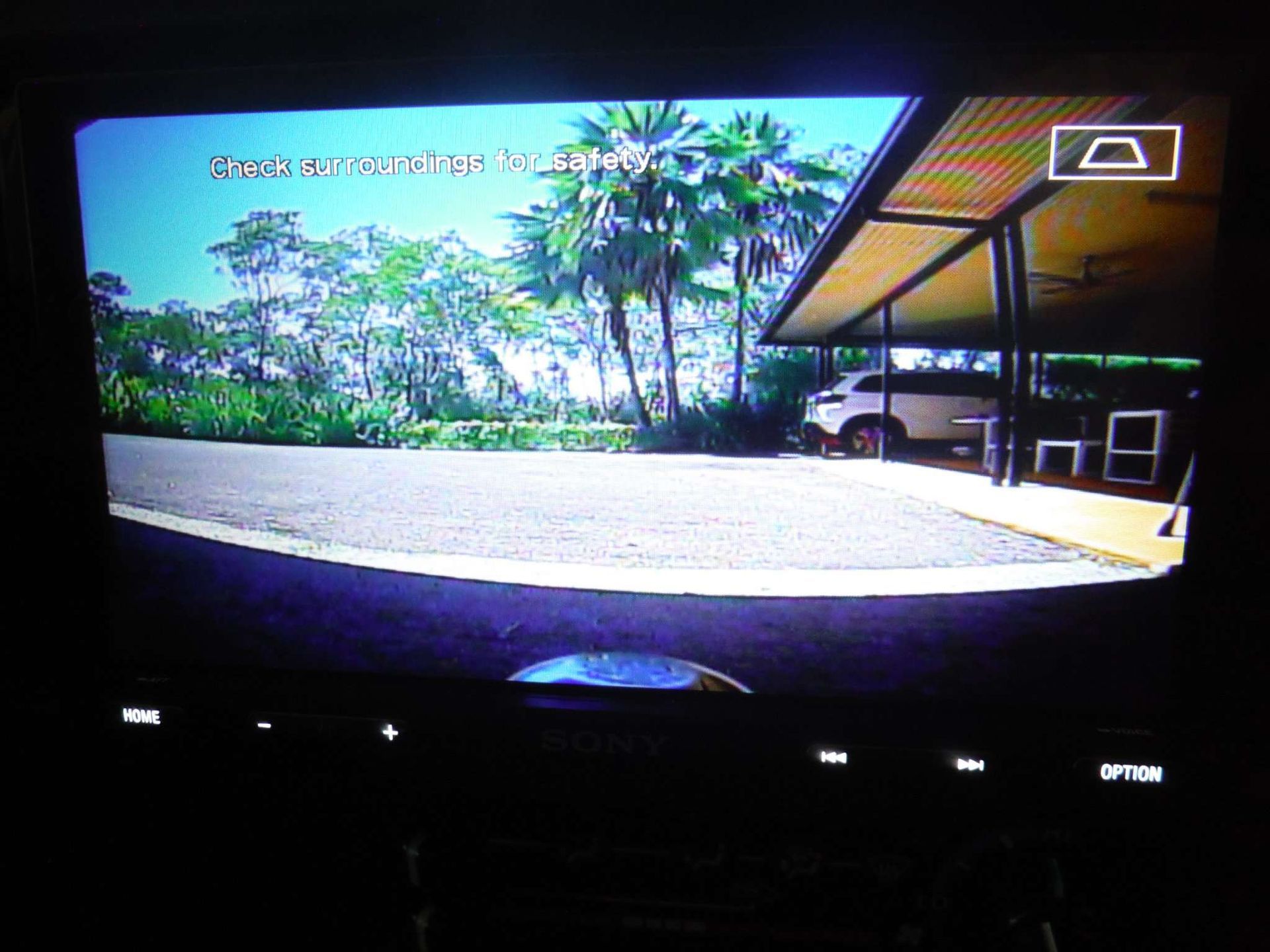 A Rear View Camera Shows A Car Parked In A Driveway — Prestige Automotive NT In Yarrawonga, NT