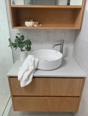 A Bathroom With A Sink And A Towel On The Counter  — Stone Arc in Kincumber, NSW