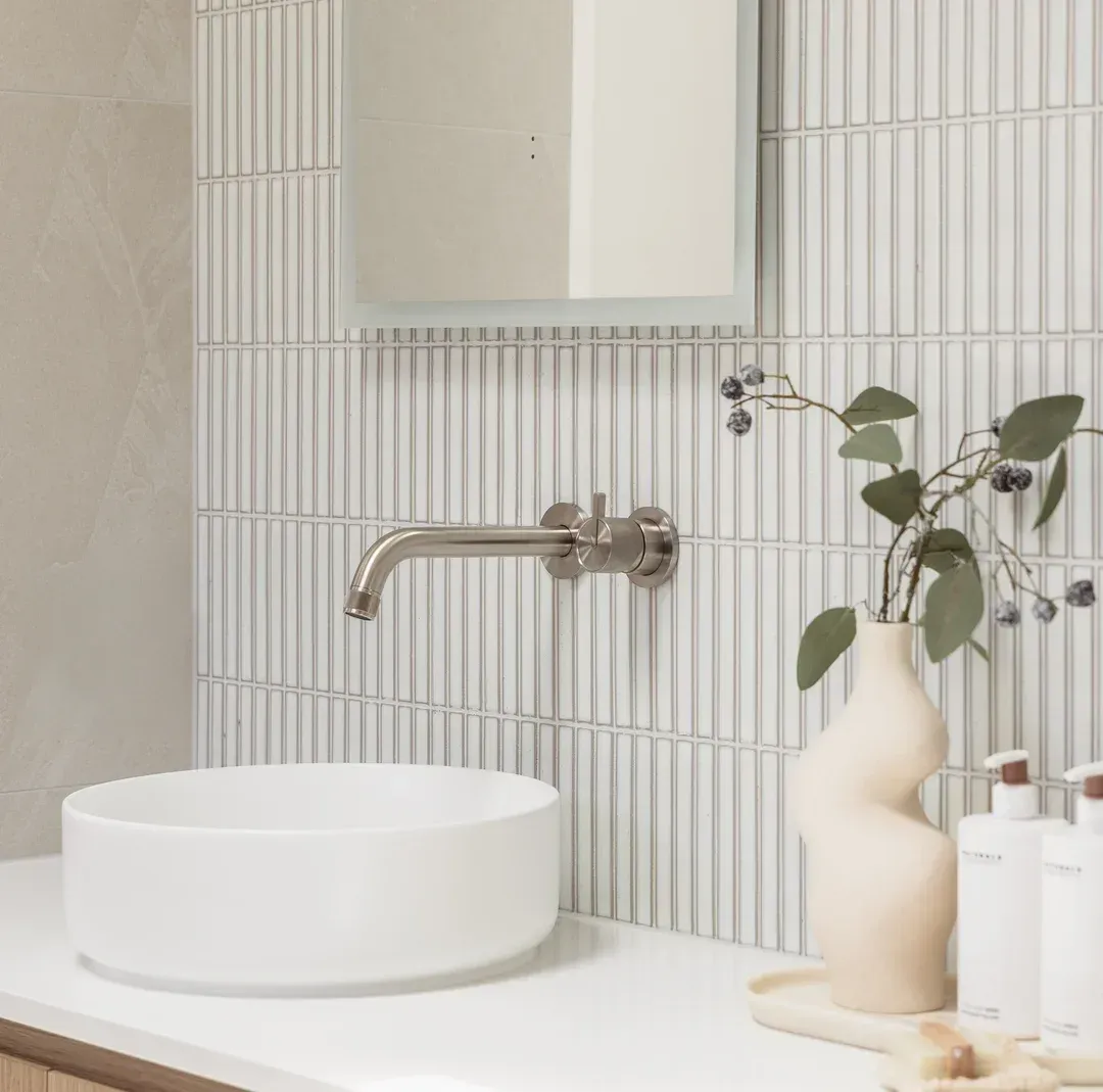 Bathroom With White Sink, Wall-mounted Faucet, and Vertical Tile Backsplash — Stone Arc in Kincumber, NSW