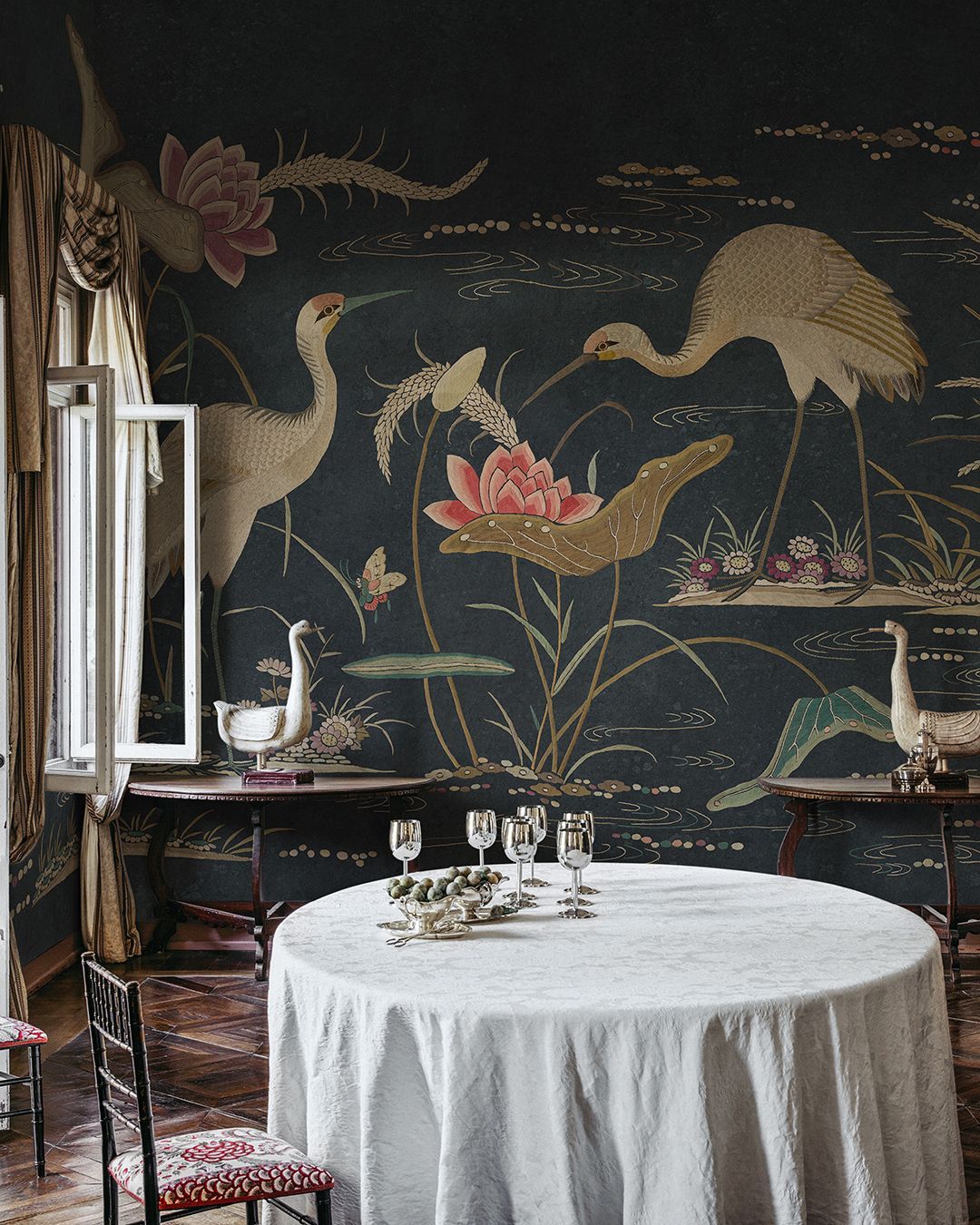 A Table With A White Tablecloth In Front Of A Wall With Birds And Flowers On It  — Stone Arc in Kincumber, NSW