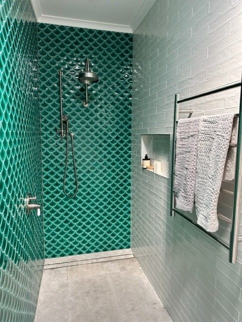 A Bathroom With Green Tiles And A Shower  — Stone Arc in Kincumber, NSW