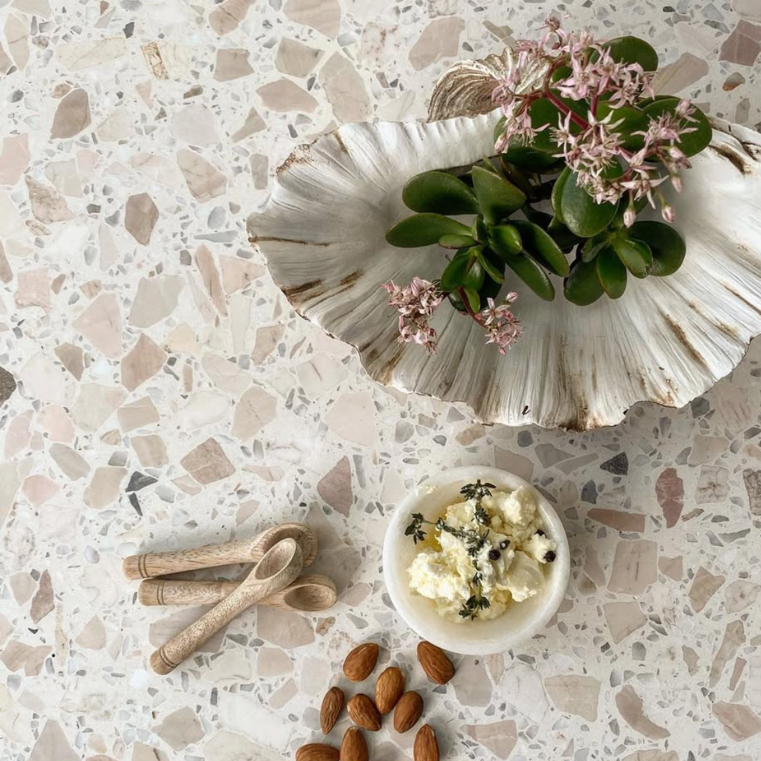 Terrazzo Surface With Seashell, Small Dish of Food, Almonds, Wooden Spoons, and Flowers — Stone Arc in Kincumber, NSW