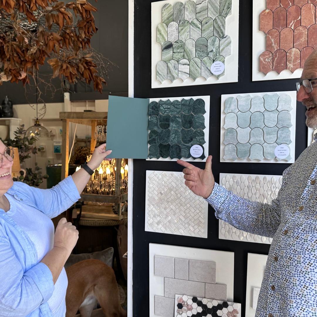 Two People Selecting Tile Samples; Woman Holds Paint Swatch, Man Points at Dark Green Tile — Stone Arc in Kincumber, NSW