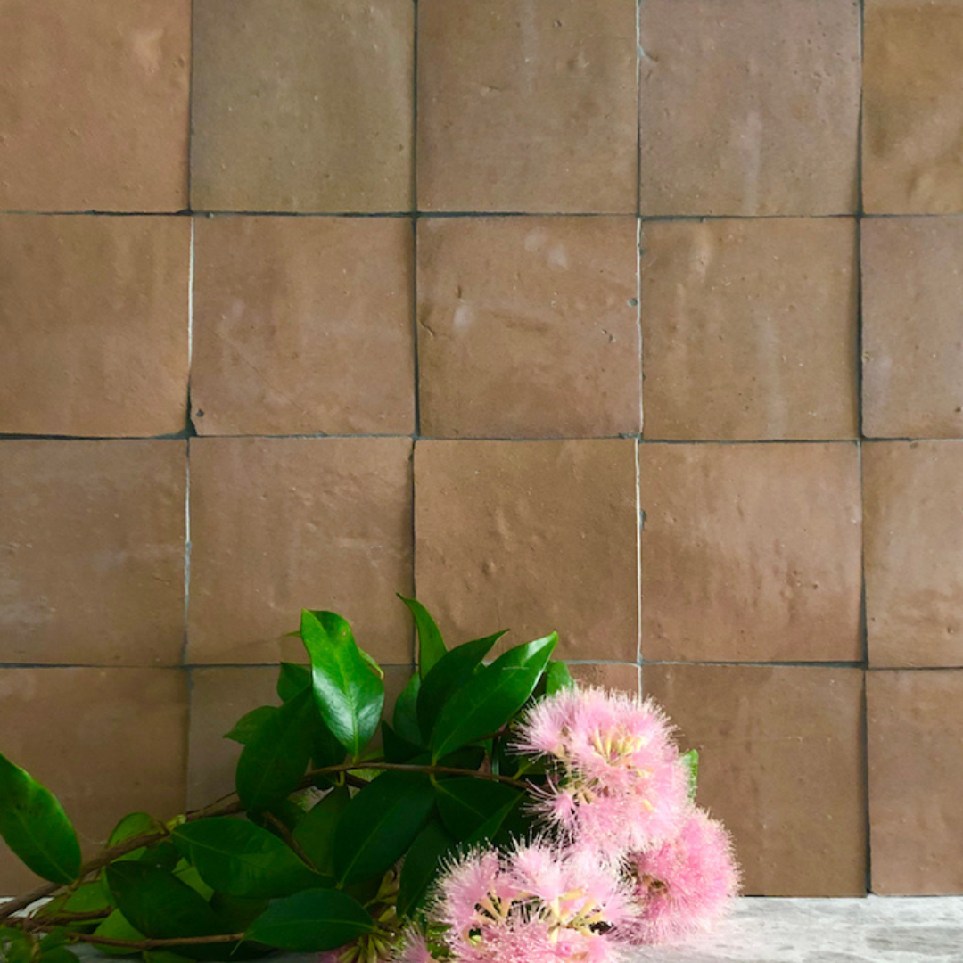 Brown Square Tiles Form a Wall With Pink Flowers — Stone Arc in Kincumber, NSW
